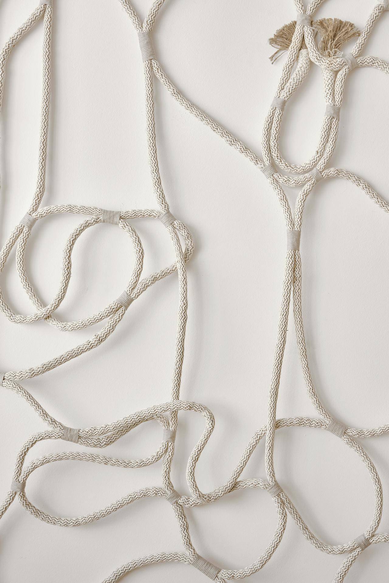 Photo by cocarinne : https://www.pexels.com/photo/tied-rope-decorating-light-wall-in-room-7260273/