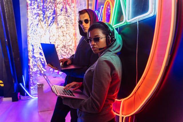 Photo by Antoni Shkraba: https://www.pexels.com/photo/man-in-green-hoodie-and-black-sunglasses-sitting-on-orange-chair-5475784/